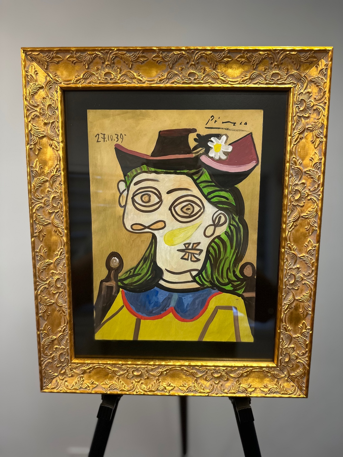 Woman in Hat, 27.10.39 (after Picasso) — gouache; spiral eyes, daisy motif.