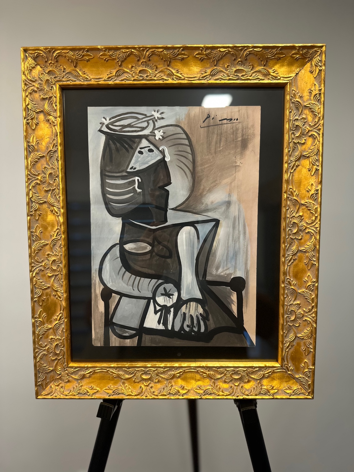 Seated Woman with Cup (after Picasso) — gray gouache; strong contour, ornamental hands.